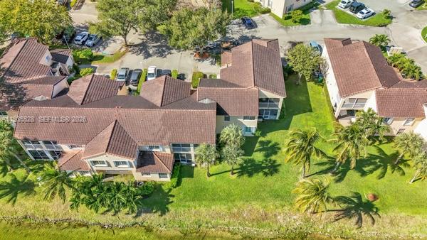 14817 Balgowan Road, Unit 2015 Miami Lakes, FL 33016 - Photo 29 of 39 an aerial view of a house with swimming pool and garden