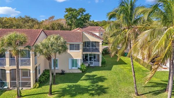 14817 Balgowan Road, Unit 2015 Miami Lakes, FL 33016 - Photo 32 of 39 front view of a house with a yard