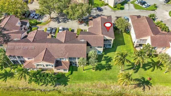 14817 Balgowan Road, Unit 2015 Miami Lakes, FL 33016 - Photo 36 of 39 an aerial view of a house with a yard and tree s