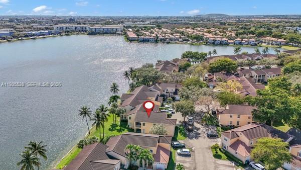 14817 Balgowan Road, Unit 2015 Miami Lakes, FL 33016 - Photo 37 of 39 an aerial view of lake and residential houses with outdoor space