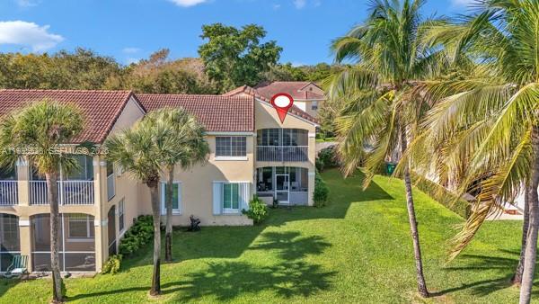 14817 Balgowan Road, Unit 2015 Miami Lakes, FL 33016 - Photo 39 of 39 a front view of a house with a yard