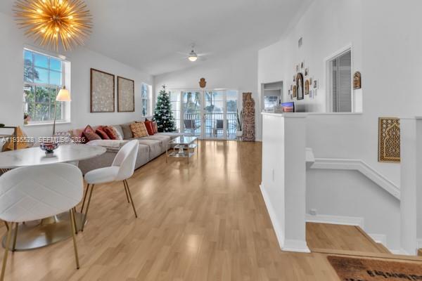 14817 Balgowan Road, Unit 2015 Miami Lakes, FL 33016 - Photo 6 of 39 a living room with furniture and a wooden floor