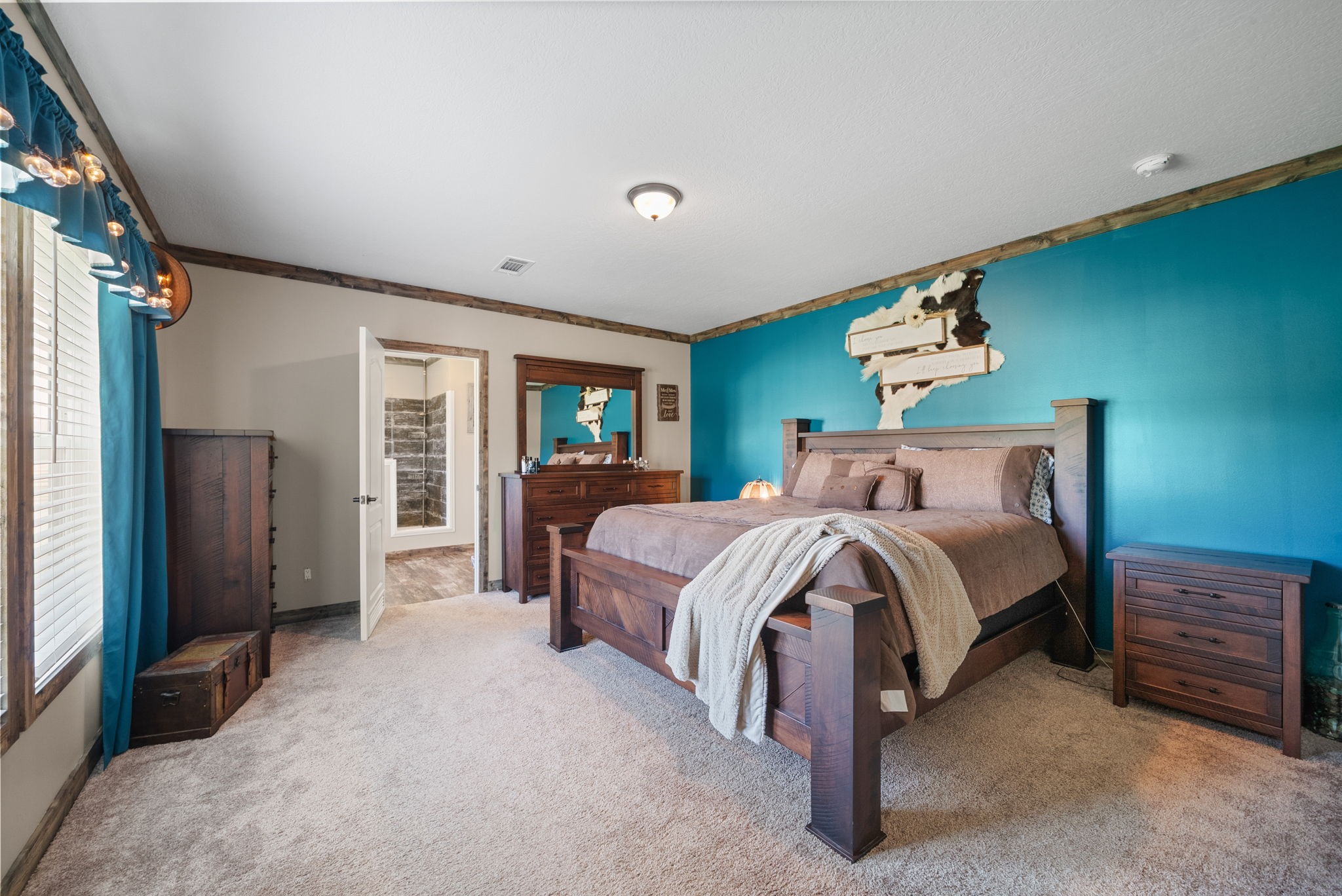 164 Meredith Lane Guthrie, KY 42234 - Photo 17 of 57 a spacious bedroom with a bed a dresser next to a window