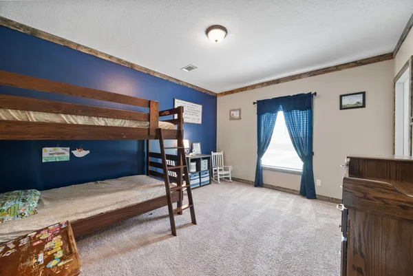 a room with furniture and a chair