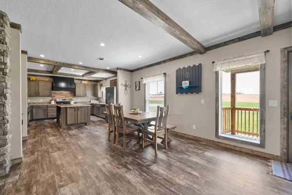 a view of a kitchen and dining room