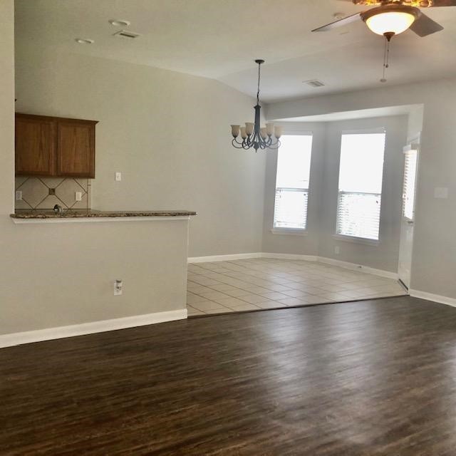 21338 Bella Flora Court Spring, TX 77379 - Photo 4 of 10 an empty room with wooden floor and windows