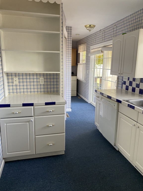10 Frederic Street Springfield, MA 01119 - Photo 7 of 26 a kitchen with granite countertop white cabinets and white appliances