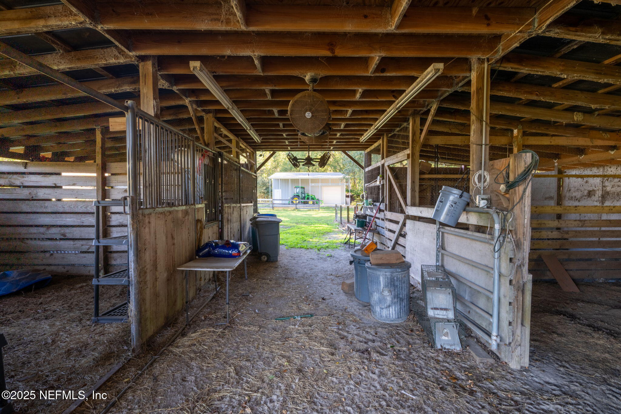 4299 Hawk Haven Road Middleburg, FL 32068 - Photo 59 of 100 Barn Interior showing 4 stalls