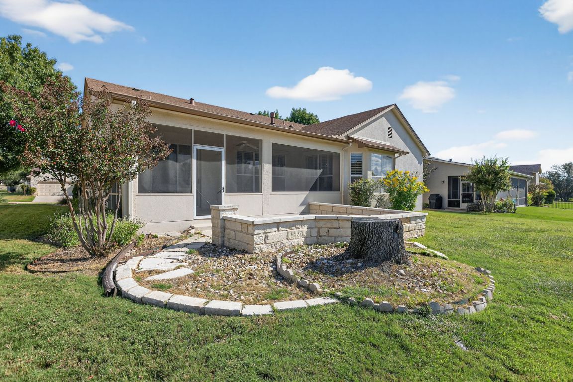 130 Crepe Myrtle Lane Georgetown, TX 78633 - Photo 28 of 33 a view of a house with backyard sitting area and garden
