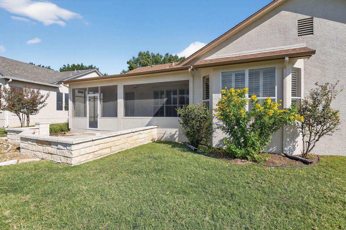 130 Crepe Myrtle Lane Georgetown, TX 78633 - Photo 29 of 33 a front view of a house with a garden and plants