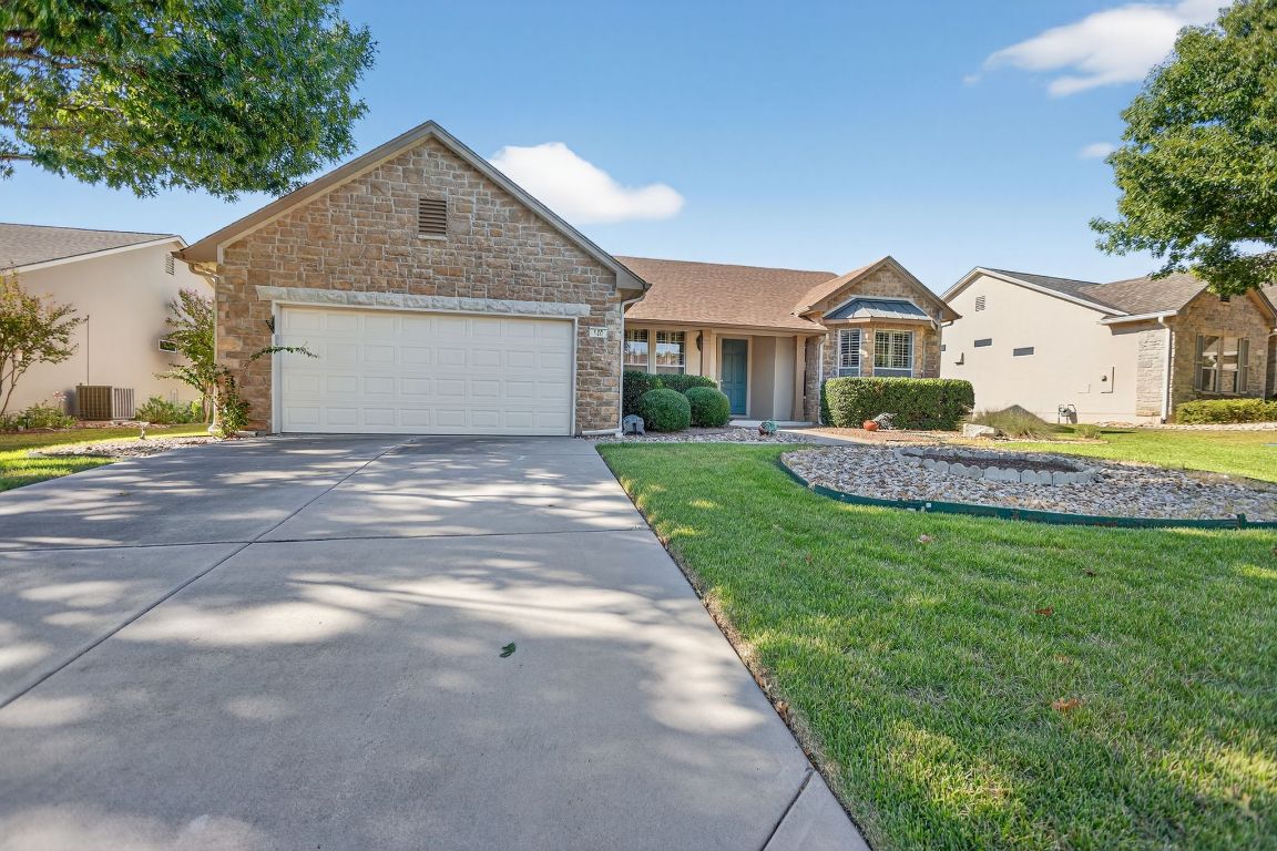 130 Crepe Myrtle Lane Georgetown, TX 78633 - Photo 31 of 33 a front view of a house with a yard and garage