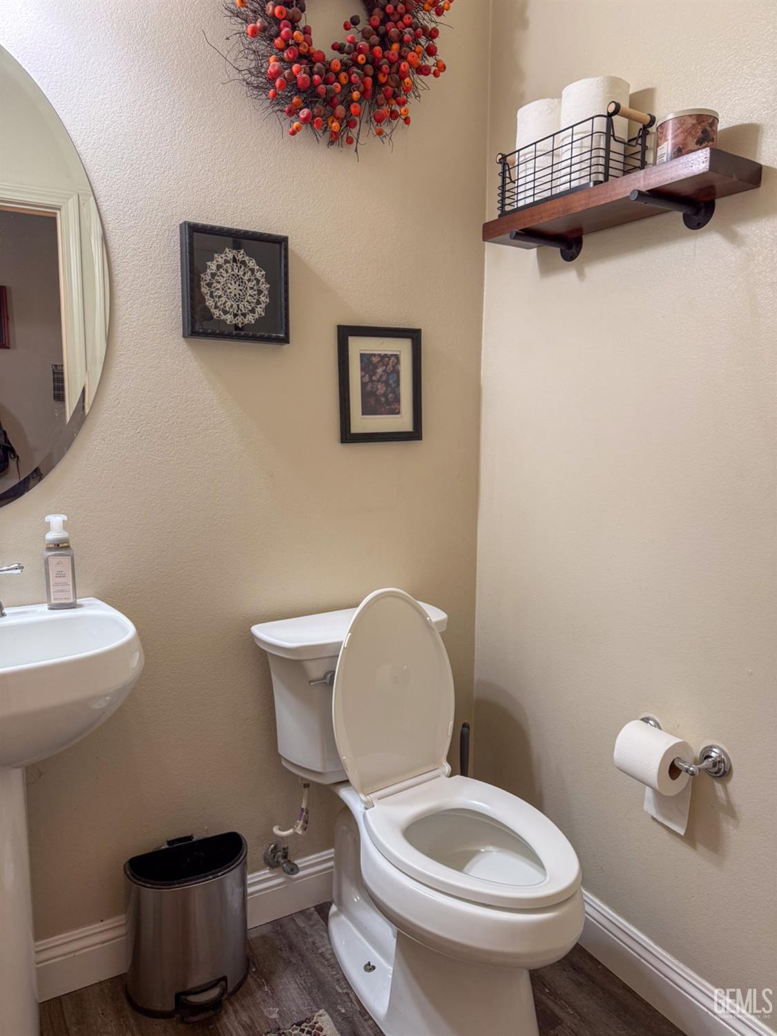 Undisclosed Address Bakersfield, CA 93306 - Photo 44 of 45 a white toilet sitting next to a bathroom sink