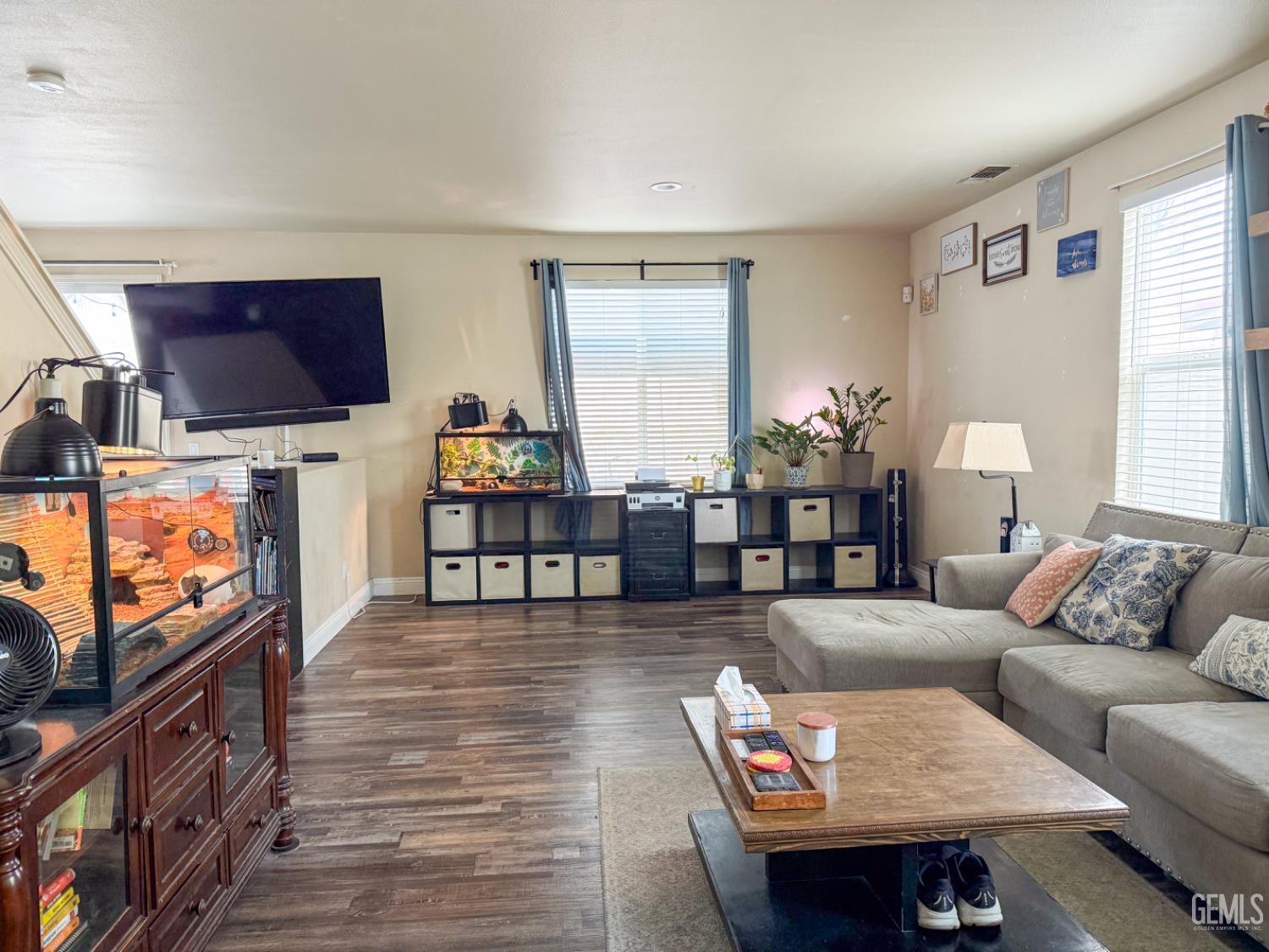 Undisclosed Address Bakersfield, CA 93306 - Photo 8 of 45 a living room with furniture and a flat screen tv