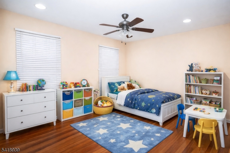 54 Campbell Road Hillsborough, NJ 08844 - Photo 21 of 31 a bedroom with a bed and a table in it