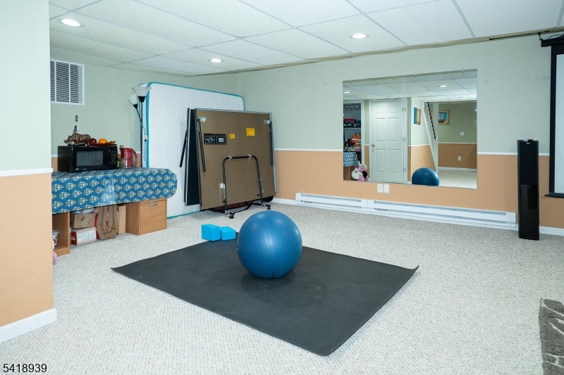 54 Campbell Road Hillsborough, NJ 08844 - Photo 25 of 31 a living room with furniture and a table