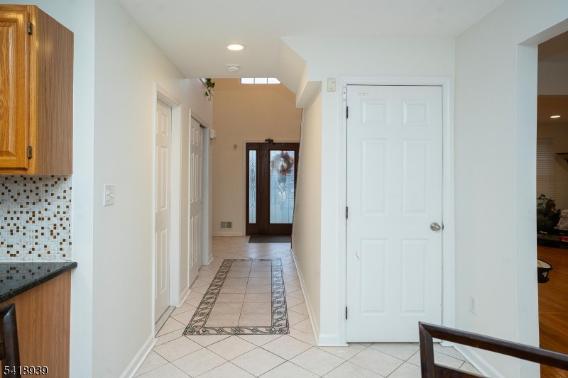 54 Campbell Road Hillsborough, NJ 08844 - Photo 4 of 31 a view of a hallway with wooden shelves