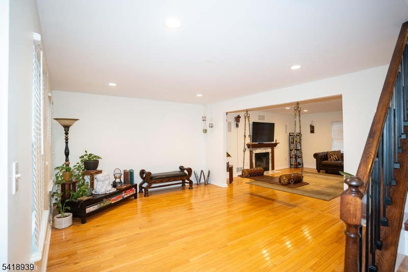 54 Campbell Road Hillsborough, NJ 08844 - Photo 5 of 31 a living room with furniture pool table and a flat screen tv