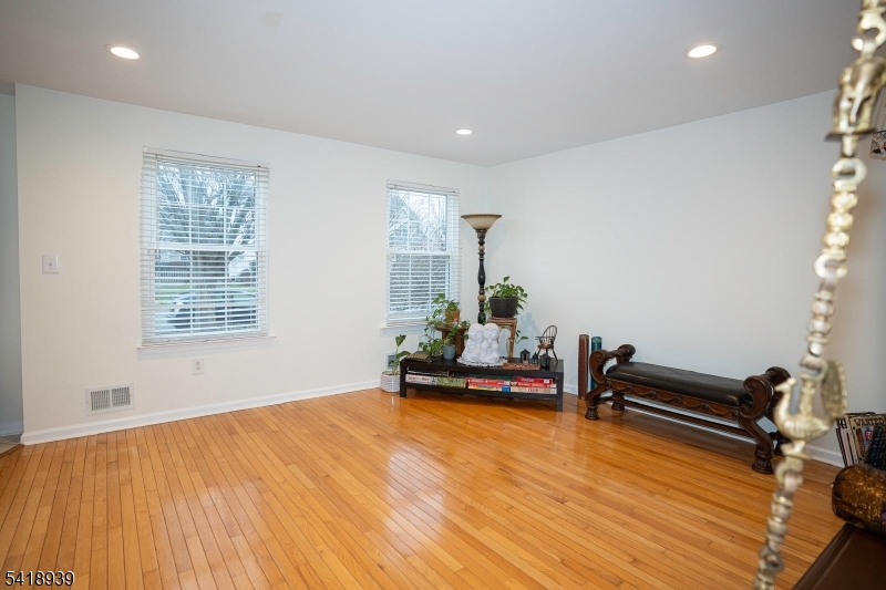 54 Campbell Road Hillsborough, NJ 08844 - Photo 6 of 31 a living room with furniture and wooden floor