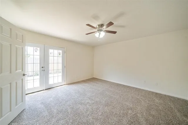 a view of empty room with windows