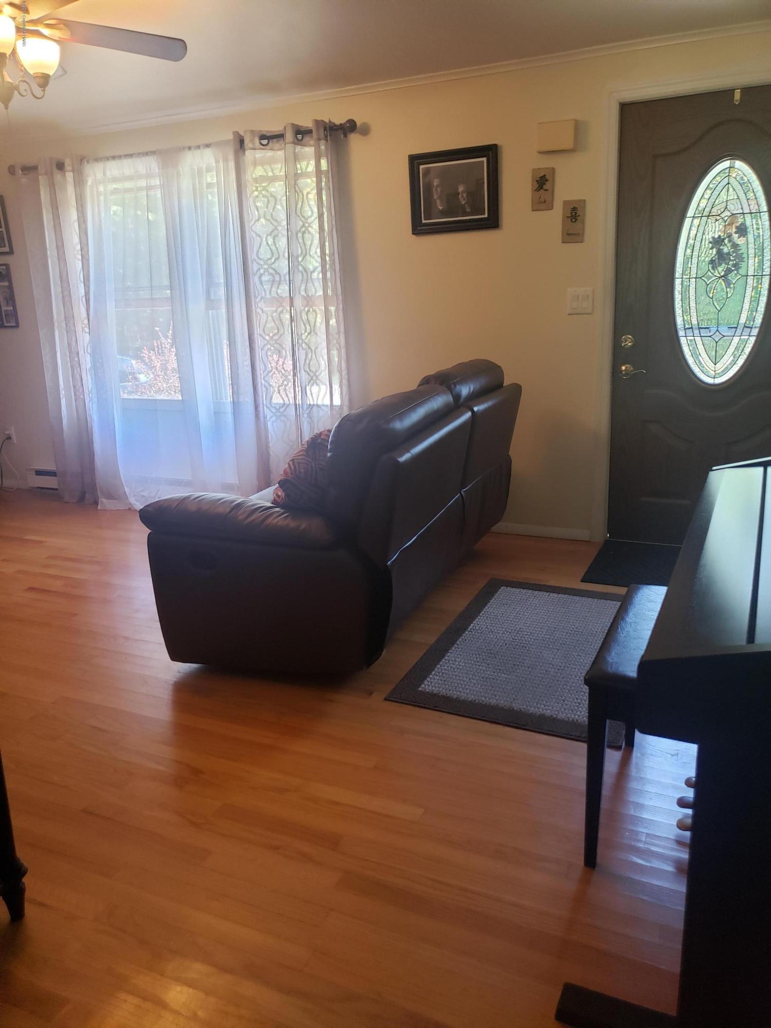 4307 Pine Ridge Drive West Bushkill, PA 18324 - Photo 12 of 28 a living room with furniture and a window