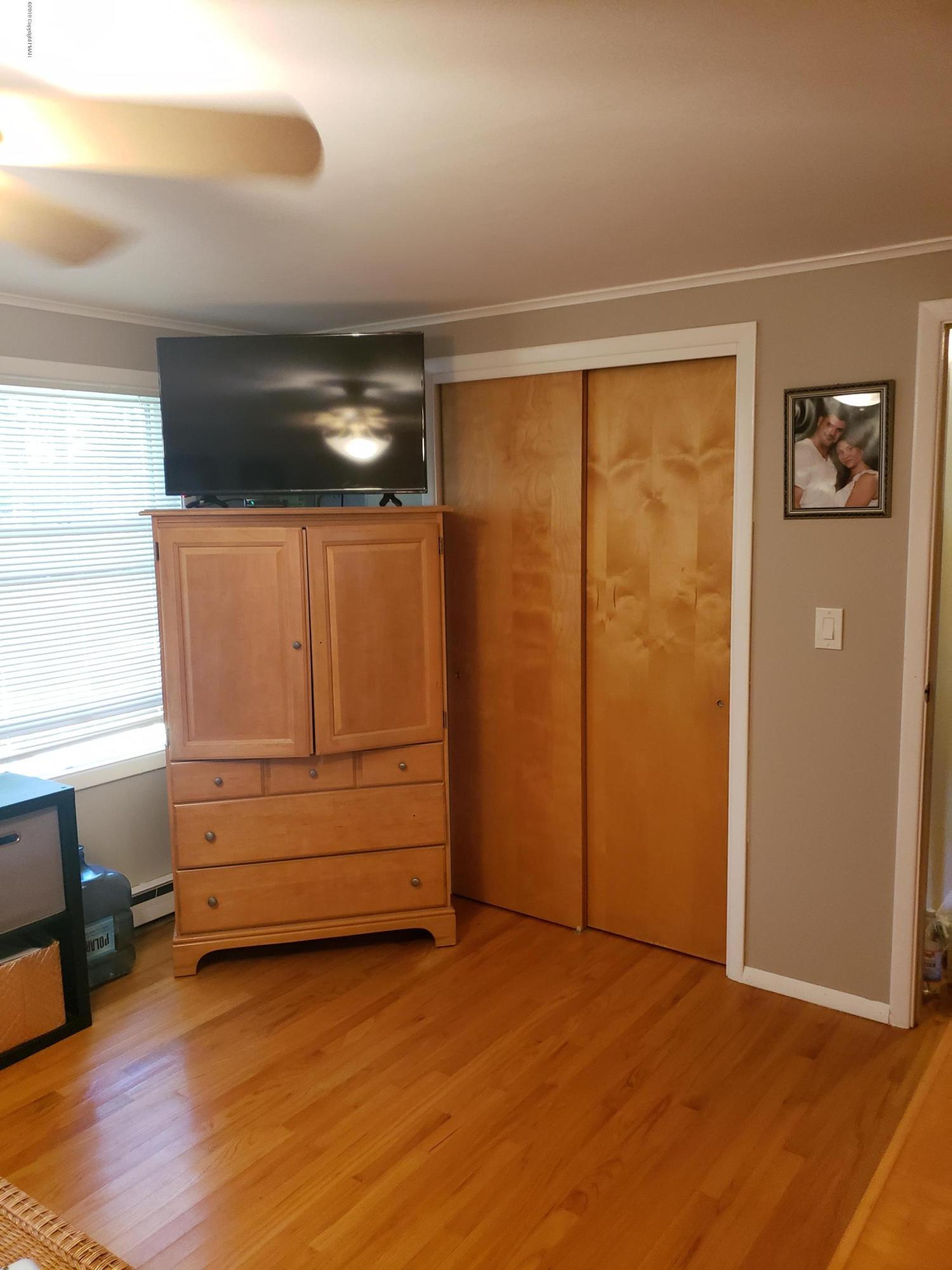 4307 Pine Ridge Drive West Bushkill, PA 18324 - Photo 15 of 28 a view of a room with wooden floor and cabinet