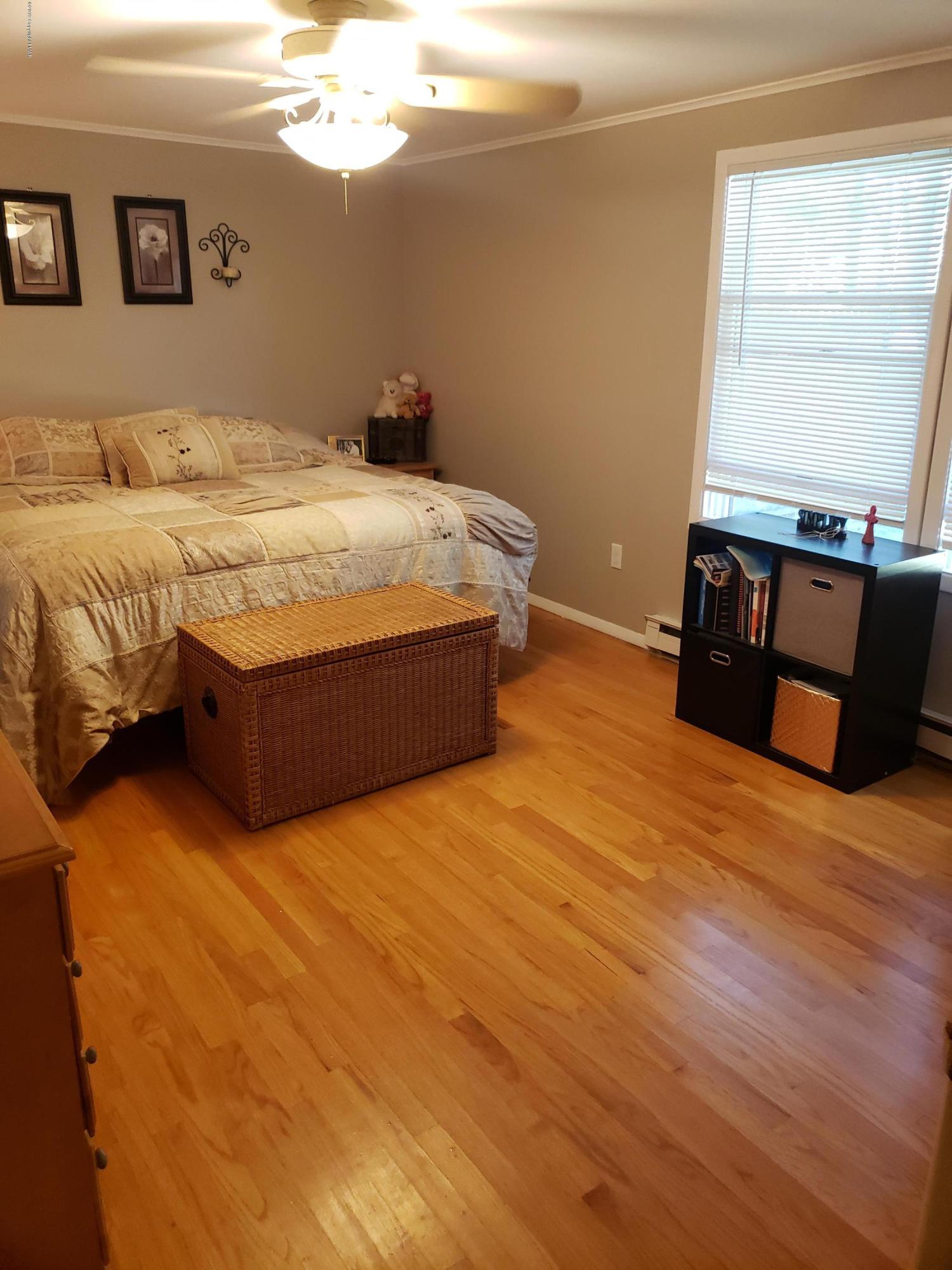 4307 Pine Ridge Drive West Bushkill, PA 18324 - Photo 16 of 28 a bedroom with a bed and window