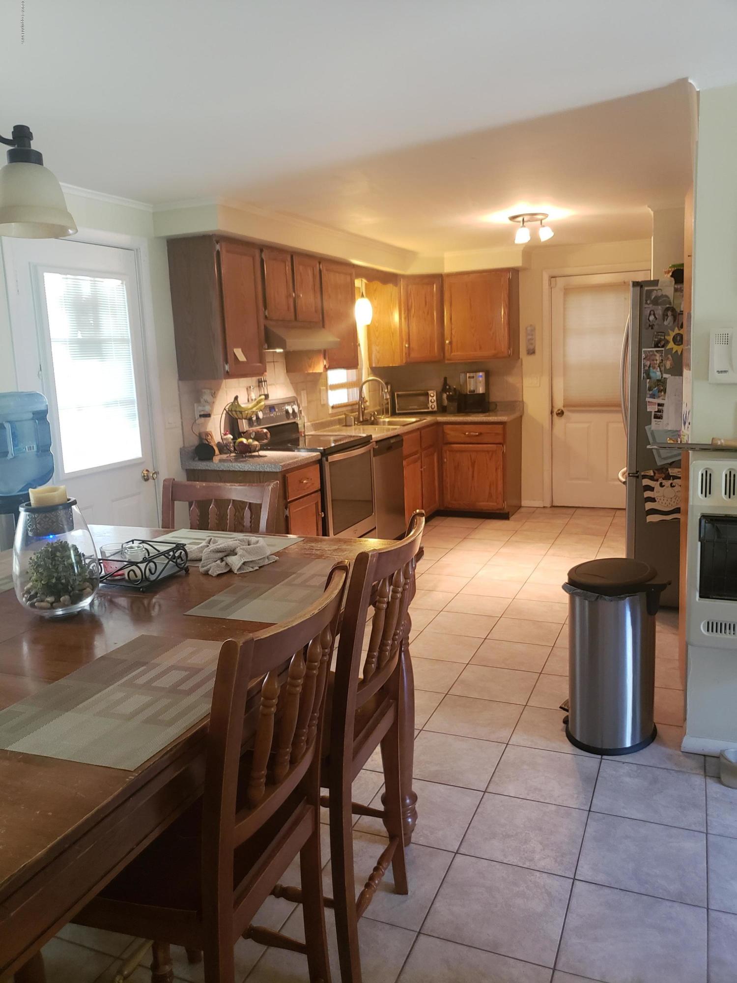 4307 Pine Ridge Drive West Bushkill, PA 18324 - Photo 6 of 28 a kitchen with a table and chairs in it