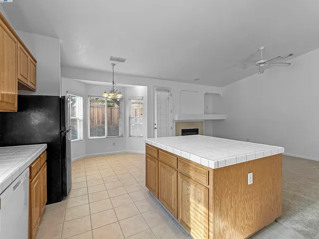 a kitchen that has a cabinets and a stove