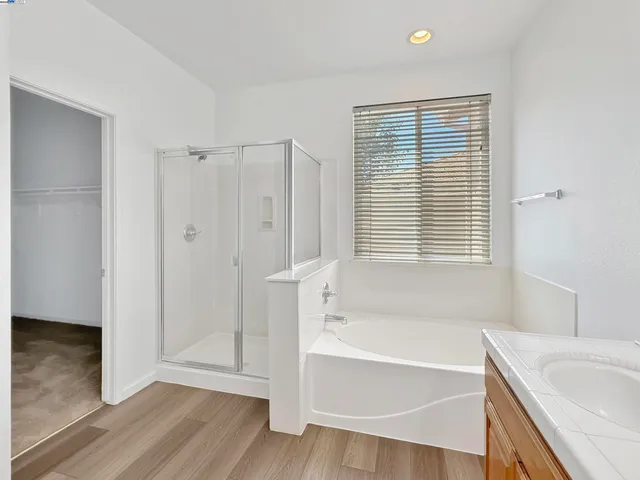 a bathroom with a tub and a sink