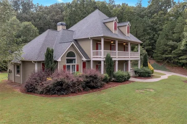 a front view of a house with garden