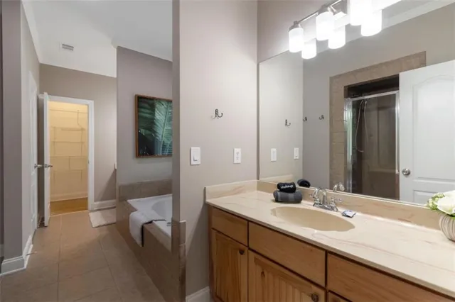a bathroom with a sink double vanity and a mirror