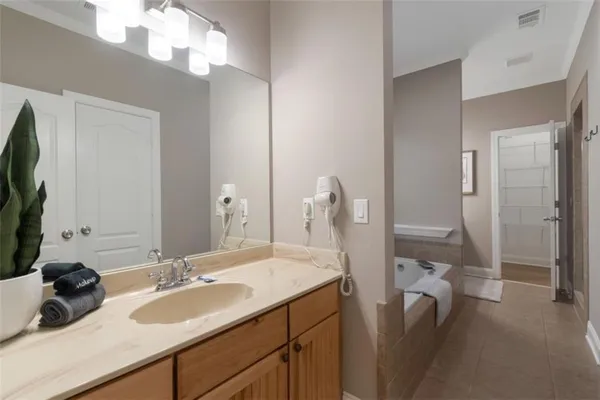 a bathroom with a double vanity sink and a mirror