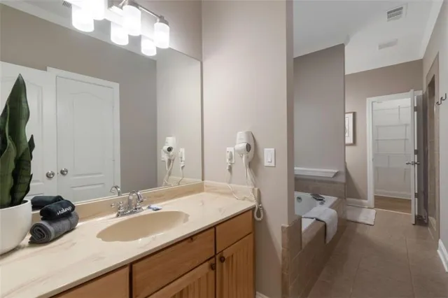 a bathroom with a double vanity sink and a mirror