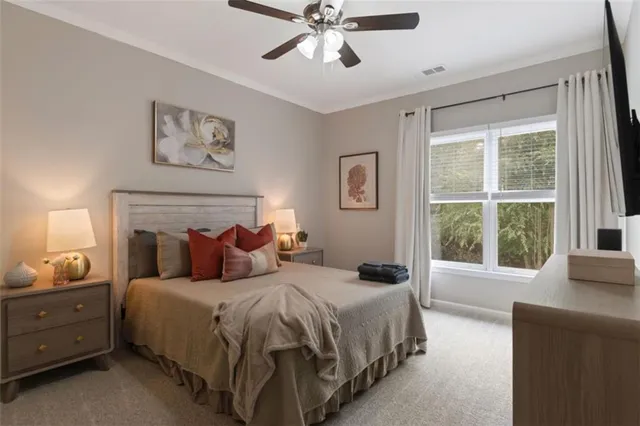 a bedroom with a bed and a window