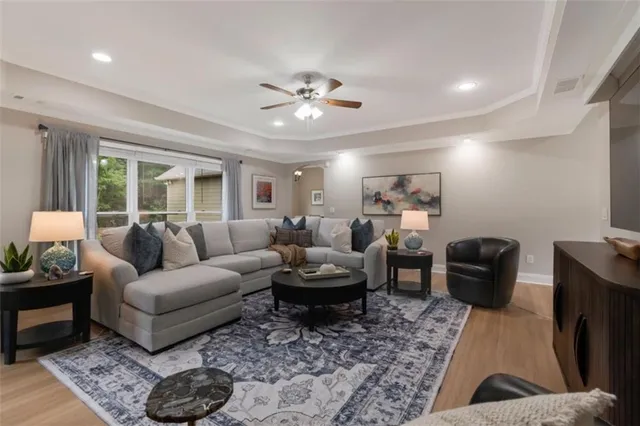 a living room with furniture and a rug