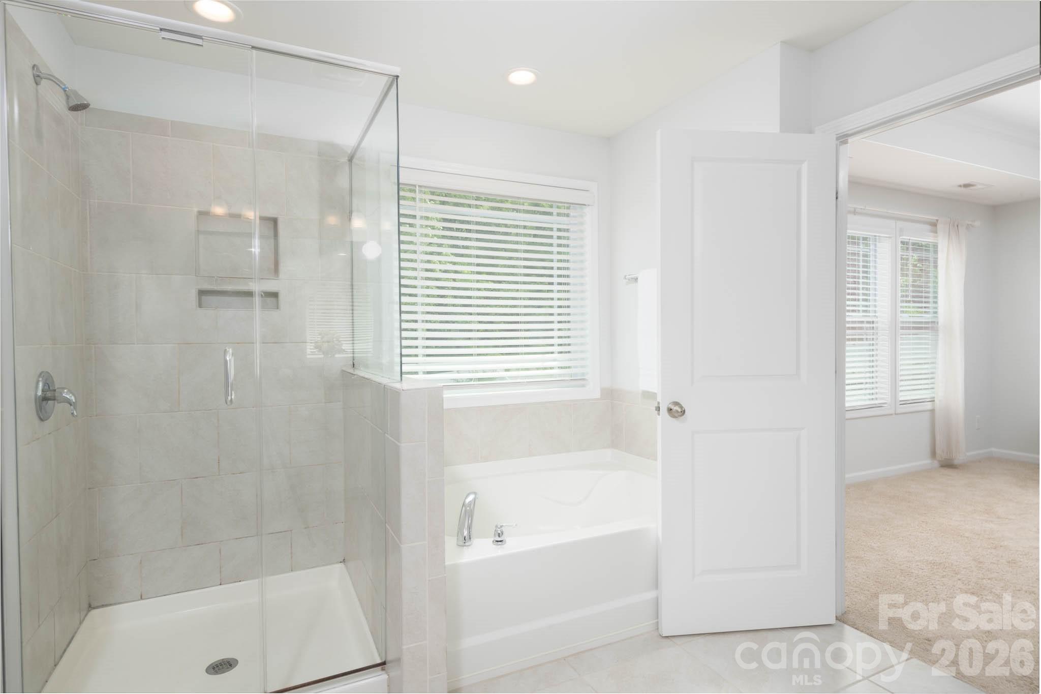 108 Chance Road Mooresville, NC 28115 - Photo 19 of 37 a bathroom with a bathtub and a shower
