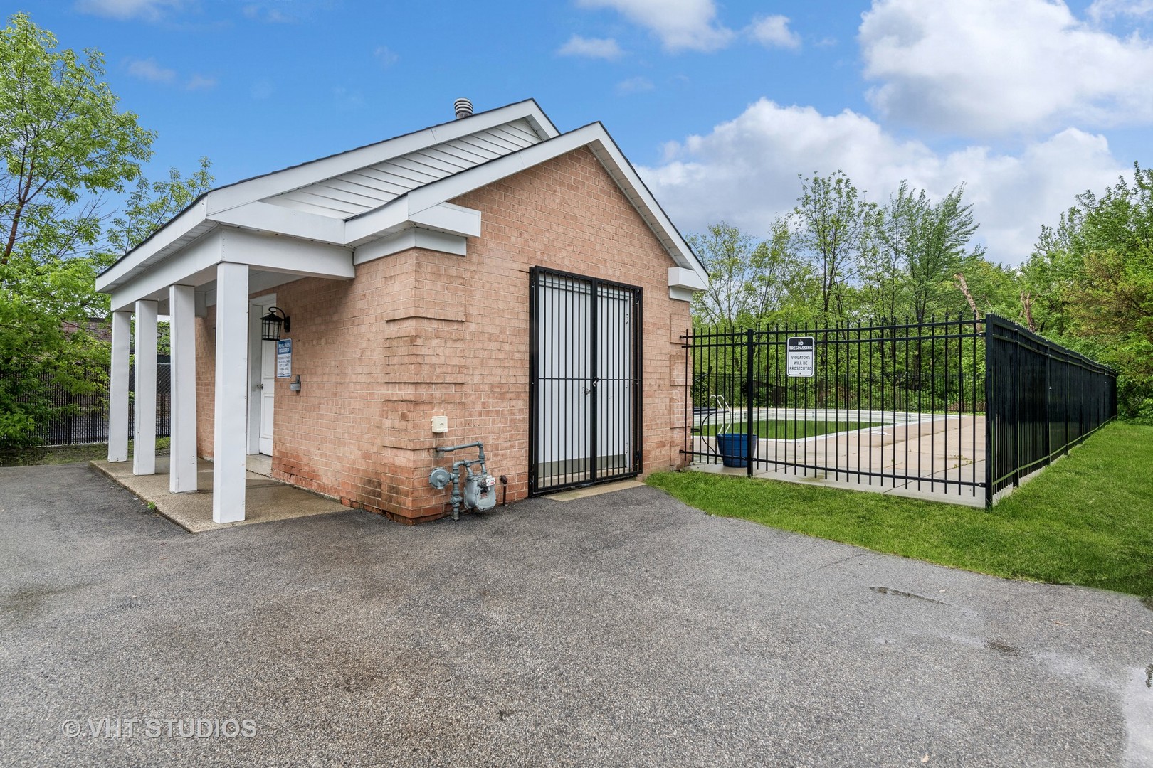 5300 Carriageway Drive, Unit 112 Rolling Meadows, IL 60008 - Photo 12 of 12 a view of a house with wooden fence