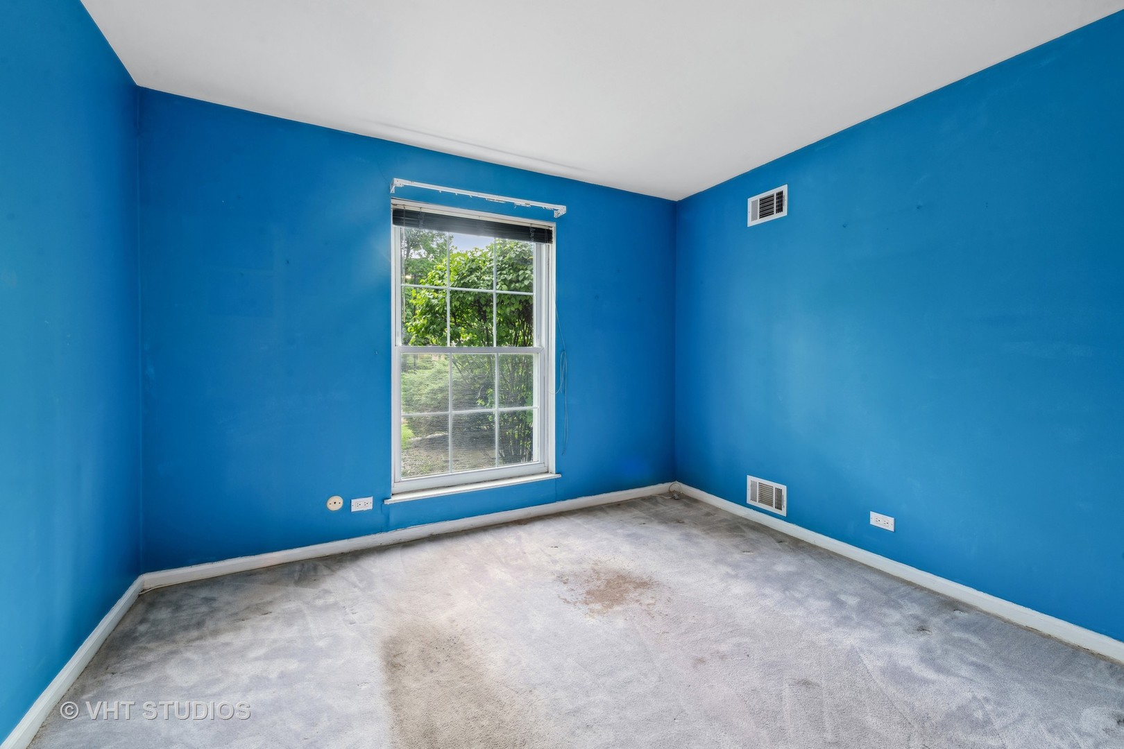 5300 Carriageway Drive, Unit 112 Rolling Meadows, IL 60008 - Photo 9 of 12 an empty room with a window