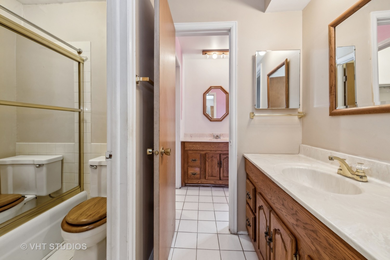 5300 Carriageway Drive, Unit 112 Rolling Meadows, IL 60008 - Photo 10 of 12 a bathroom with a sink a toilet and a mirror
