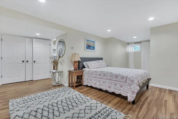 a bedroom with furniture and a window