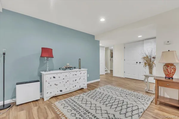 a spacious bedroom with a bed and a walk in closet
