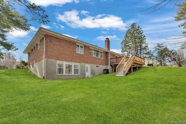 a view of a house with a yard balcony