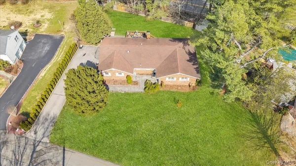 a view of a house with a backyard porch and sitting area