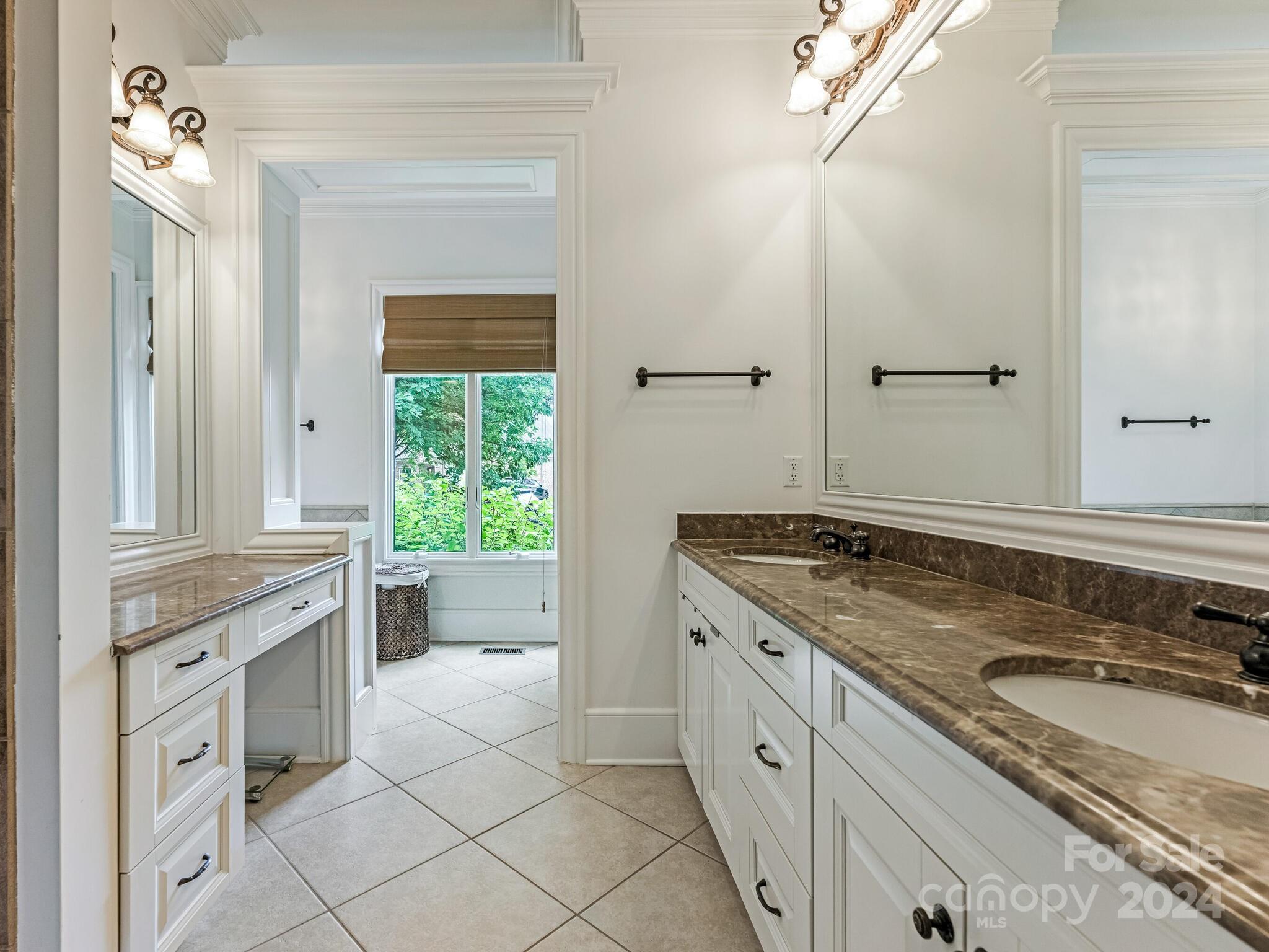 330 South Canterbury Road Charlotte, NC 28211 - Photo 12 of 41 a spacious bathroom with a granite countertop sink a mirror and a bathtub