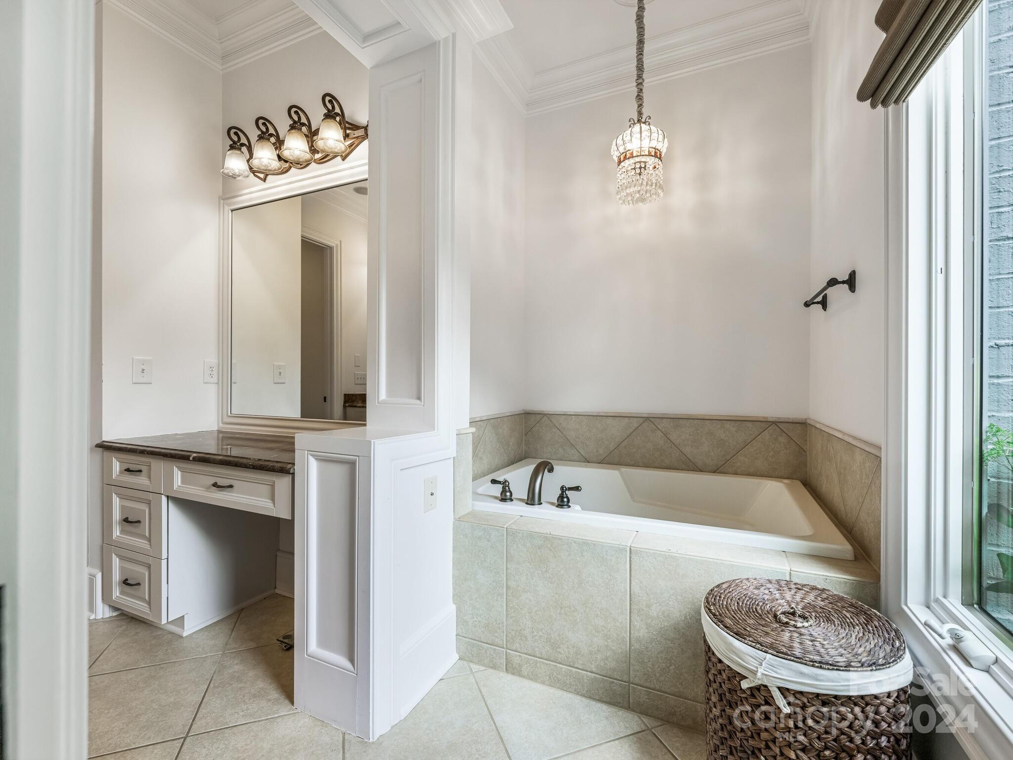 330 South Canterbury Road Charlotte, NC 28211 - Photo 13 of 41 a bathroom with a tub a sink and a window
