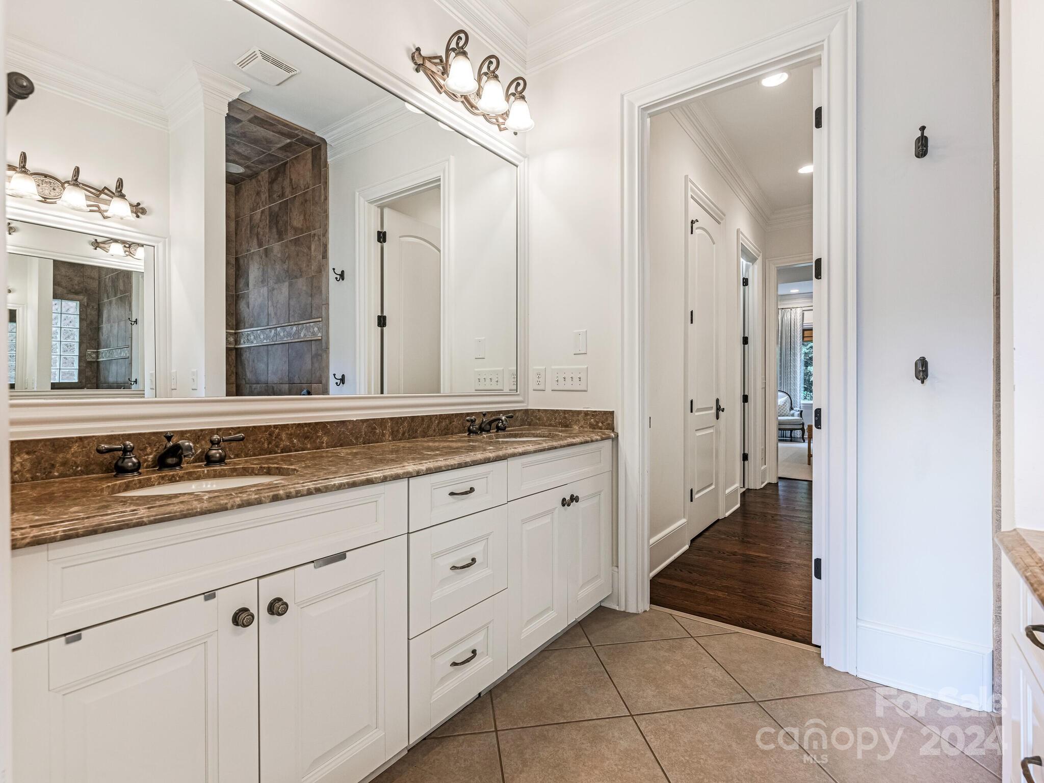 330 South Canterbury Road Charlotte, NC 28211 - Photo 14 of 41 a bathroom with a granite countertop sink mirror and a