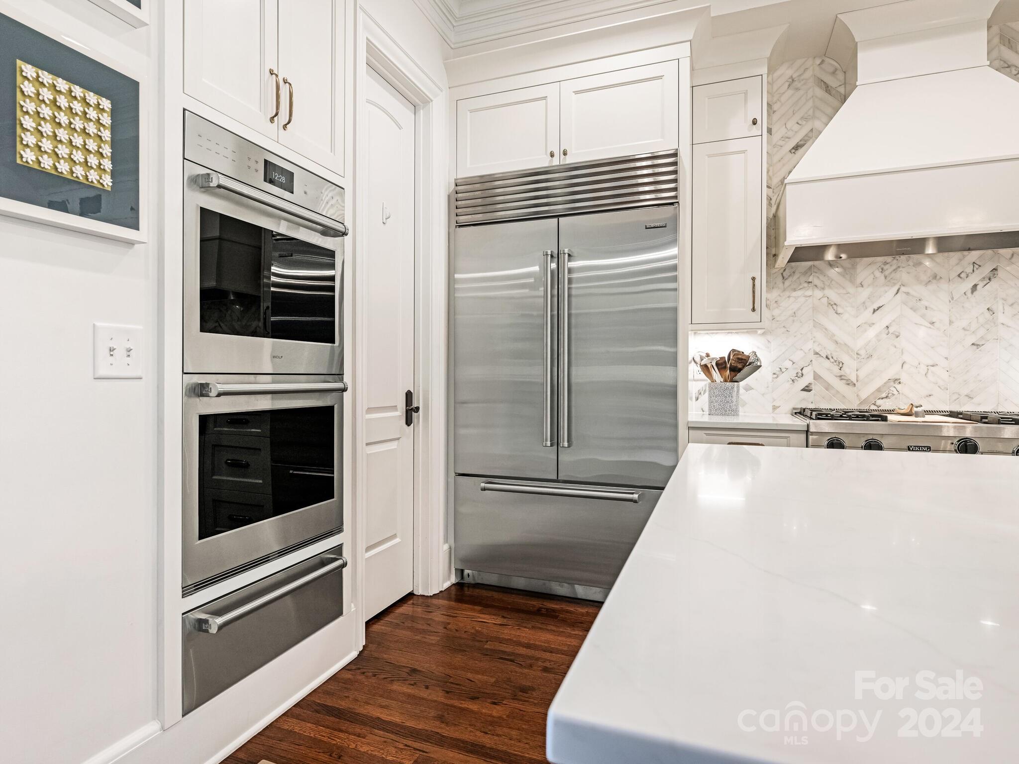 330 South Canterbury Road Charlotte, NC 28211 - Photo 17 of 41 a kitchen with granite countertop a refrigerator and a stove