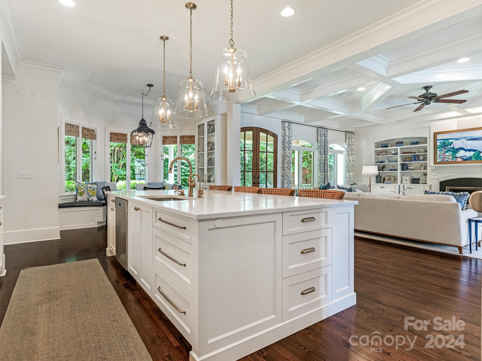 330 South Canterbury Road Charlotte, NC 28211 - Photo 19 of 41 a large white kitchen with kitchen island white cabinets and stainless steel appliances