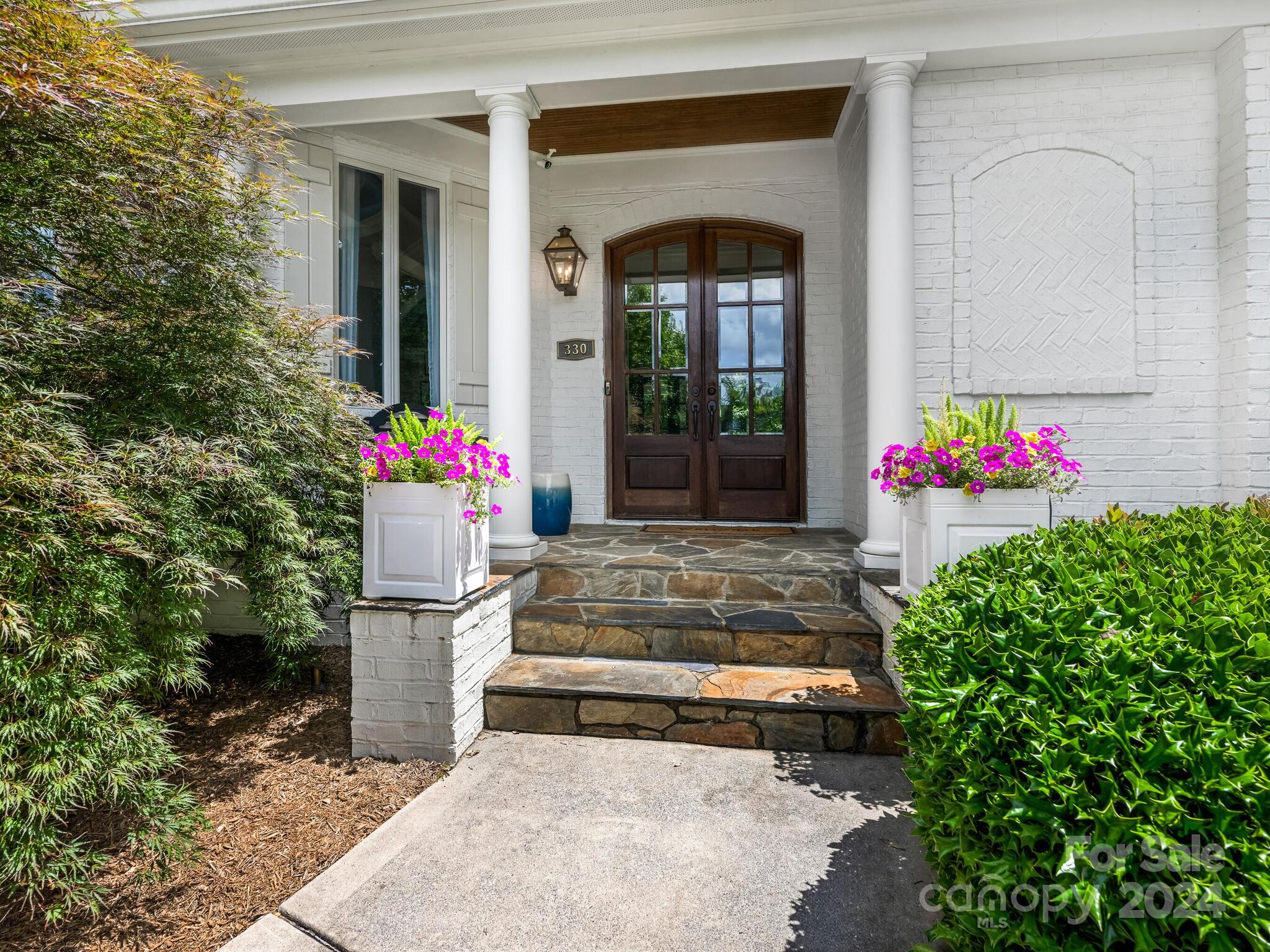 330 South Canterbury Road Charlotte, NC 28211 - Photo 2 of 41 a front view of building with flowers
