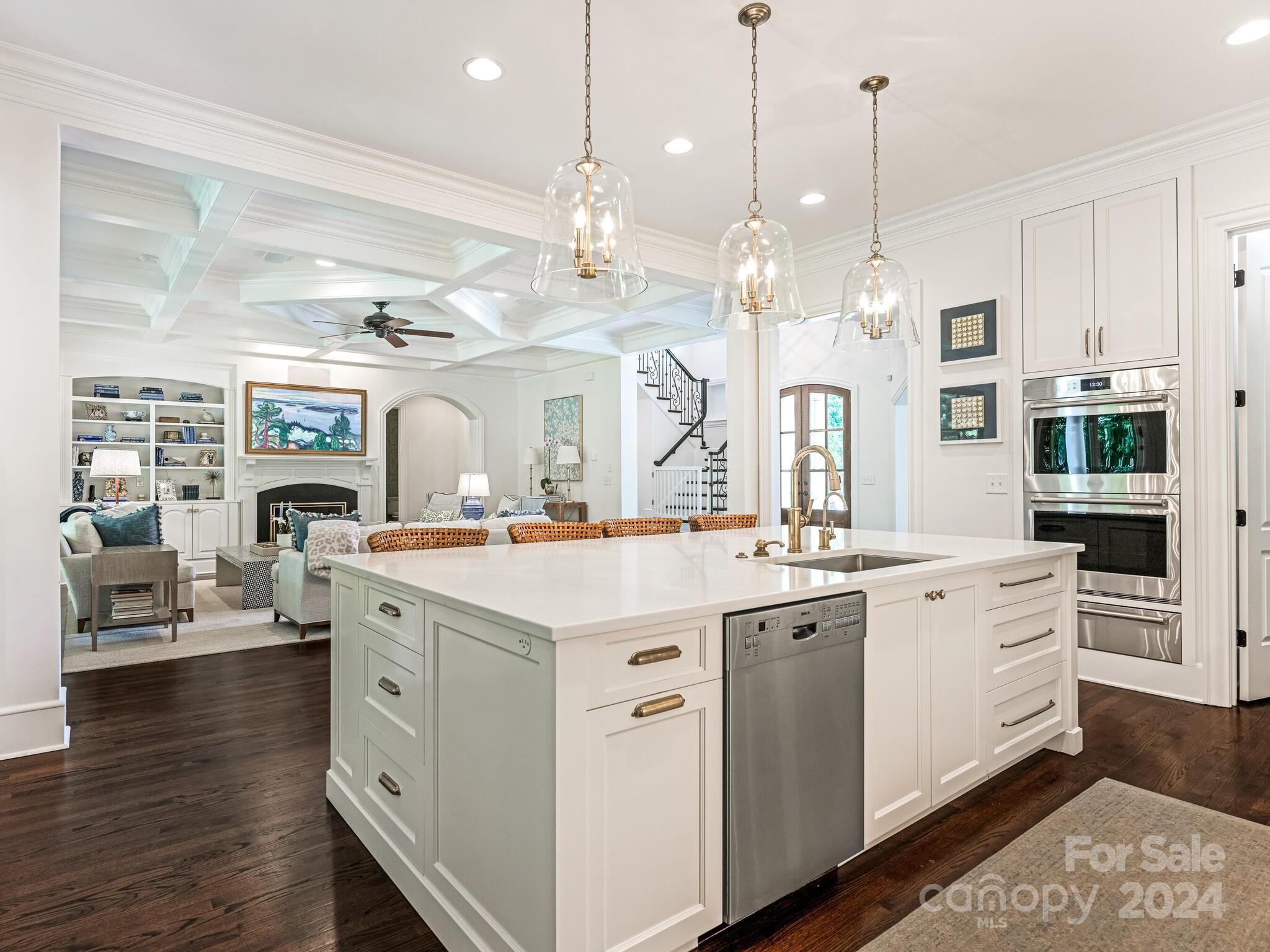 330 South Canterbury Road Charlotte, NC 28211 - Photo 22 of 41 a large kitchen with kitchen island a stove a sink a center island and wooden floor